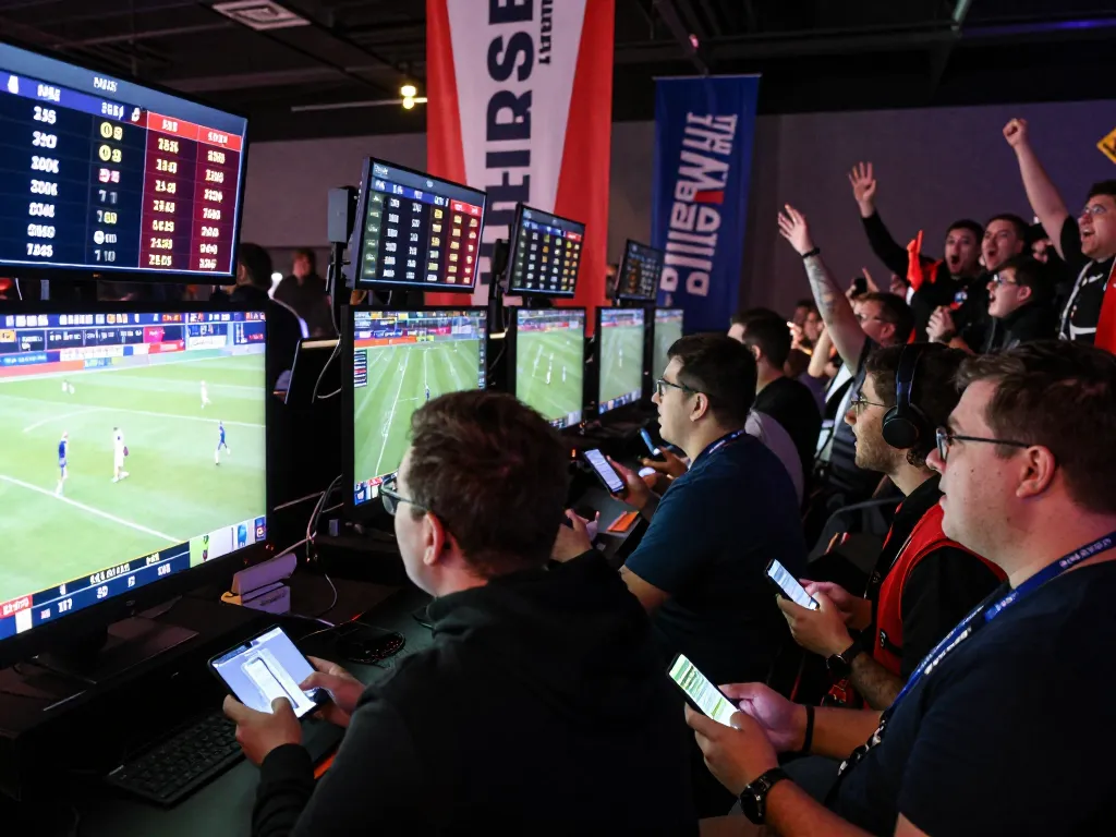 Excited bettors analyzing Keo nha cai 5 betting odds in a vibrant sports betting venue